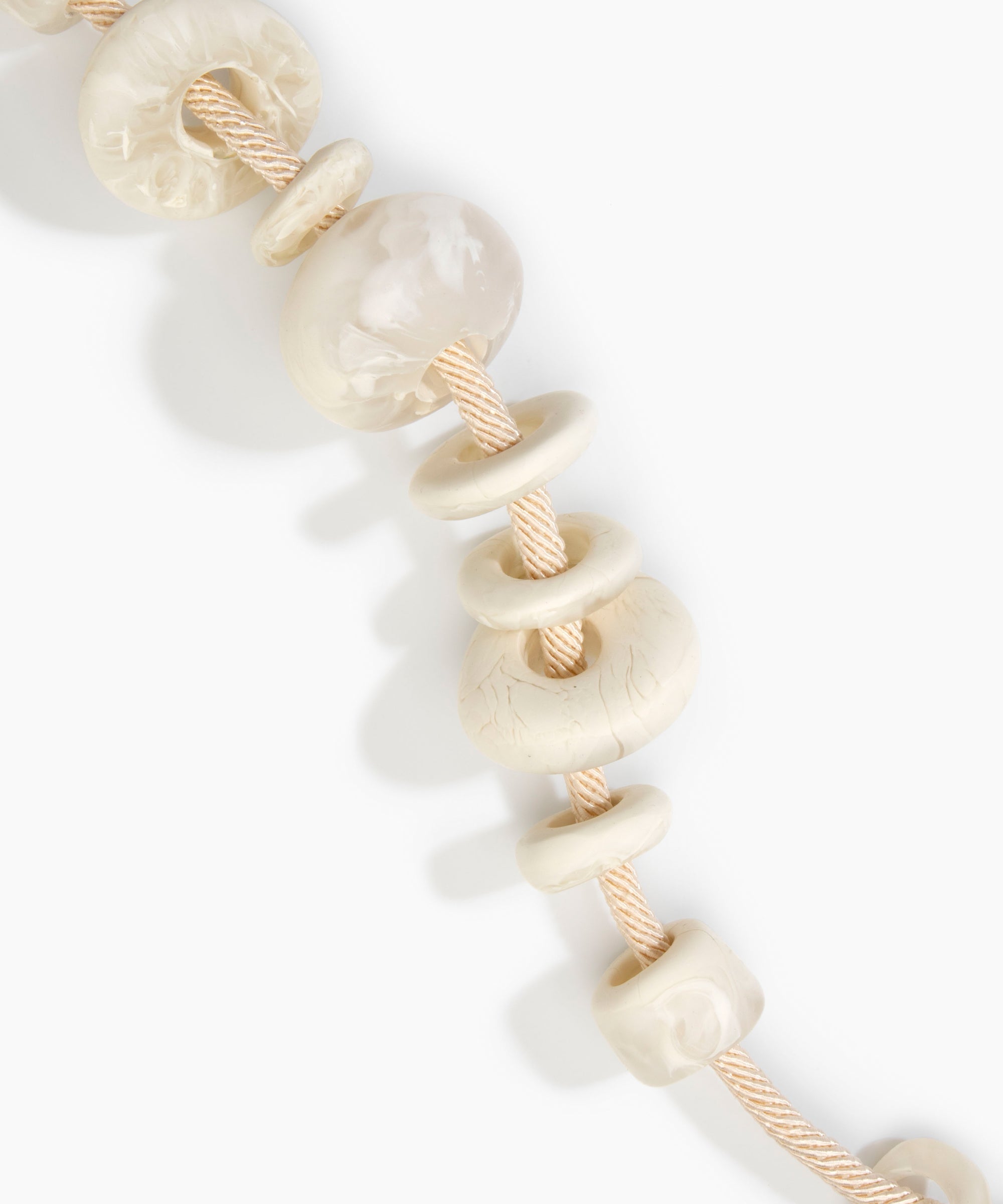 Dinosaur Designs Drift Choker in Chalk Swirl with Plated-Silver — marbled off-white resin pebble beads on a wood silk cord with silver-plated end cap