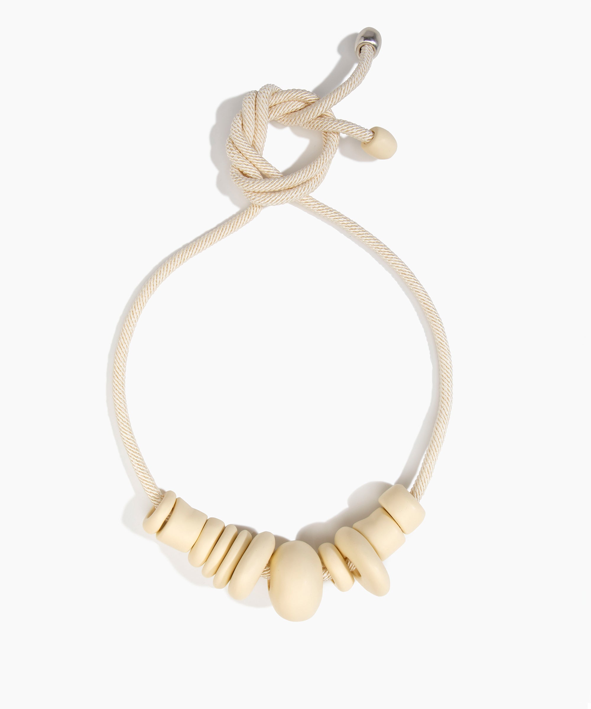 Dinosaur Designs Drift Choker in Cream with Plated-Silver — cream resin pebble beads on a wood silk cord with silver-plated end cap