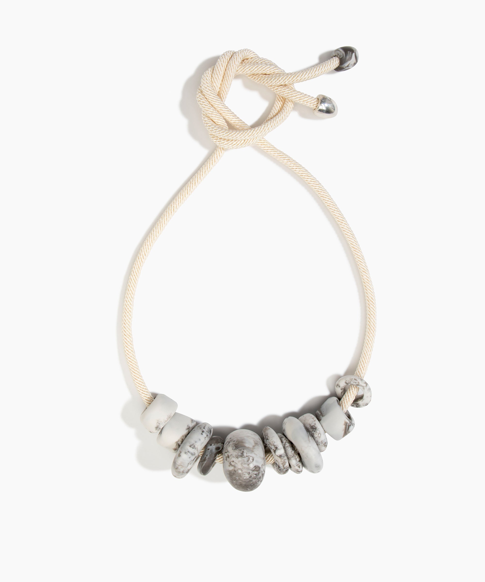 Dinosaur Designs Drift Choker in Granite with Plated-Silver — marbled cream and grey resin pebble beads on a wood silk cord with silver-plated end cap