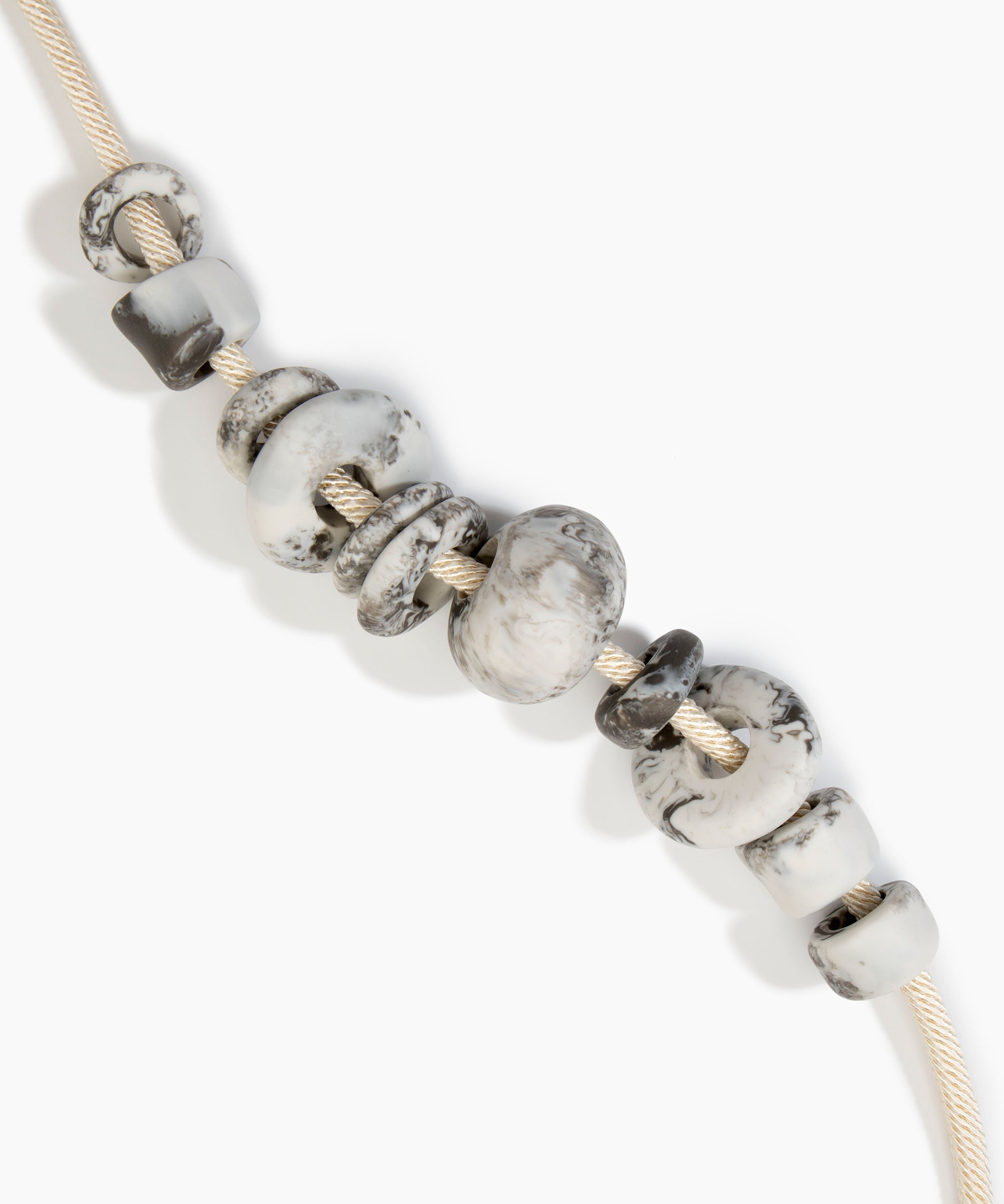 Dinosaur Designs Drift Choker in Granite with Plated-Silver — marbled cream and grey resin pebble beads on a wood silk cord with silver-plated end cap