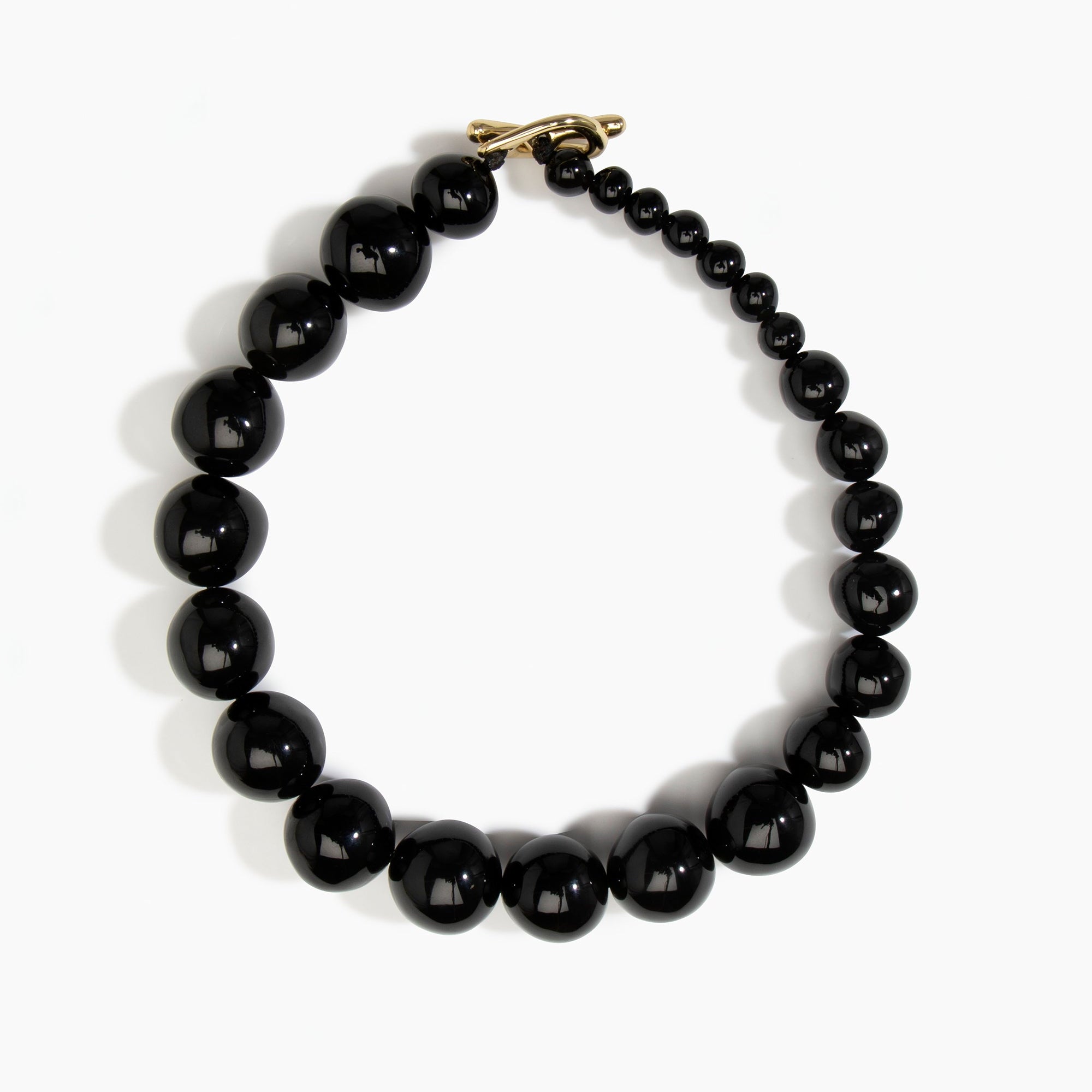 Dinosaur Designs Polished Organic Ball Choker in Black — handcrafted black polished resin graduating bead choker necklace with brass t-bar clasp...