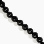 Dinosaur Designs Polished Organic Ball Choker in Black — handcrafted black polished resin graduating bead choker necklace with brass t-bar clasp.