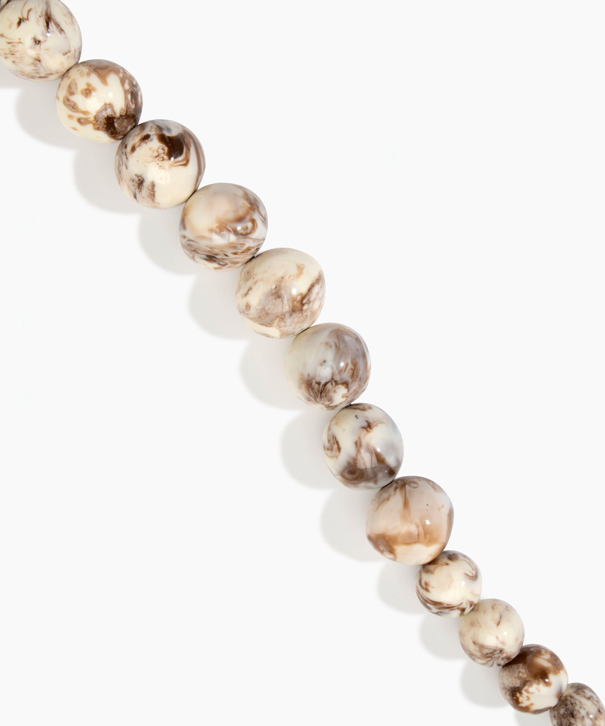 Dinosaur Designs Polished Organic Ball Choker in Cappuccino — handcrafted marbled cream and brown polished resin graduating bead choker necklace with brass t-bar clasp.