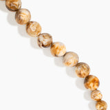 Dinosaur Designs Polished Organic Ball Choker in Light Horn — handcrafted marbled cream and brown polished resin graduating bead choker necklace with brass t-bar clasp.