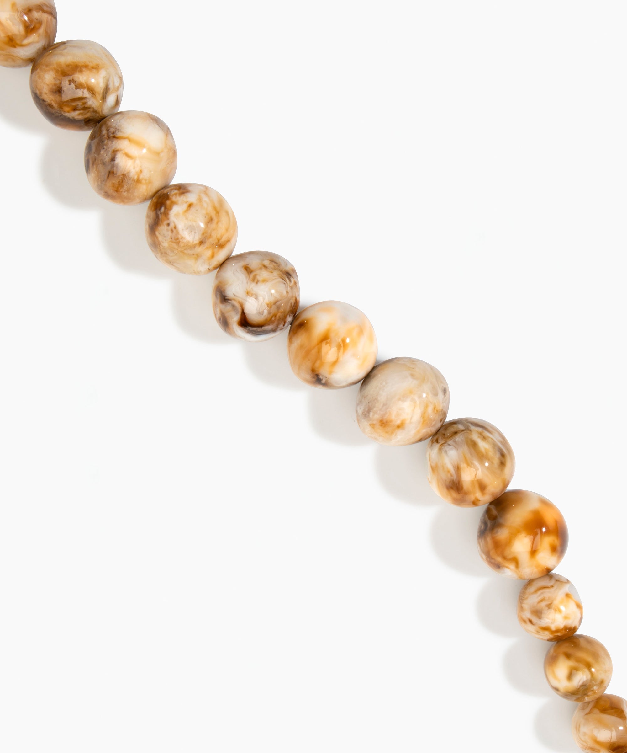 Dinosaur Designs Polished Organic Ball Choker in Light Horn — handcrafted marbled cream and brown polished resin graduating bead choker necklace with brass t-bar clasp.