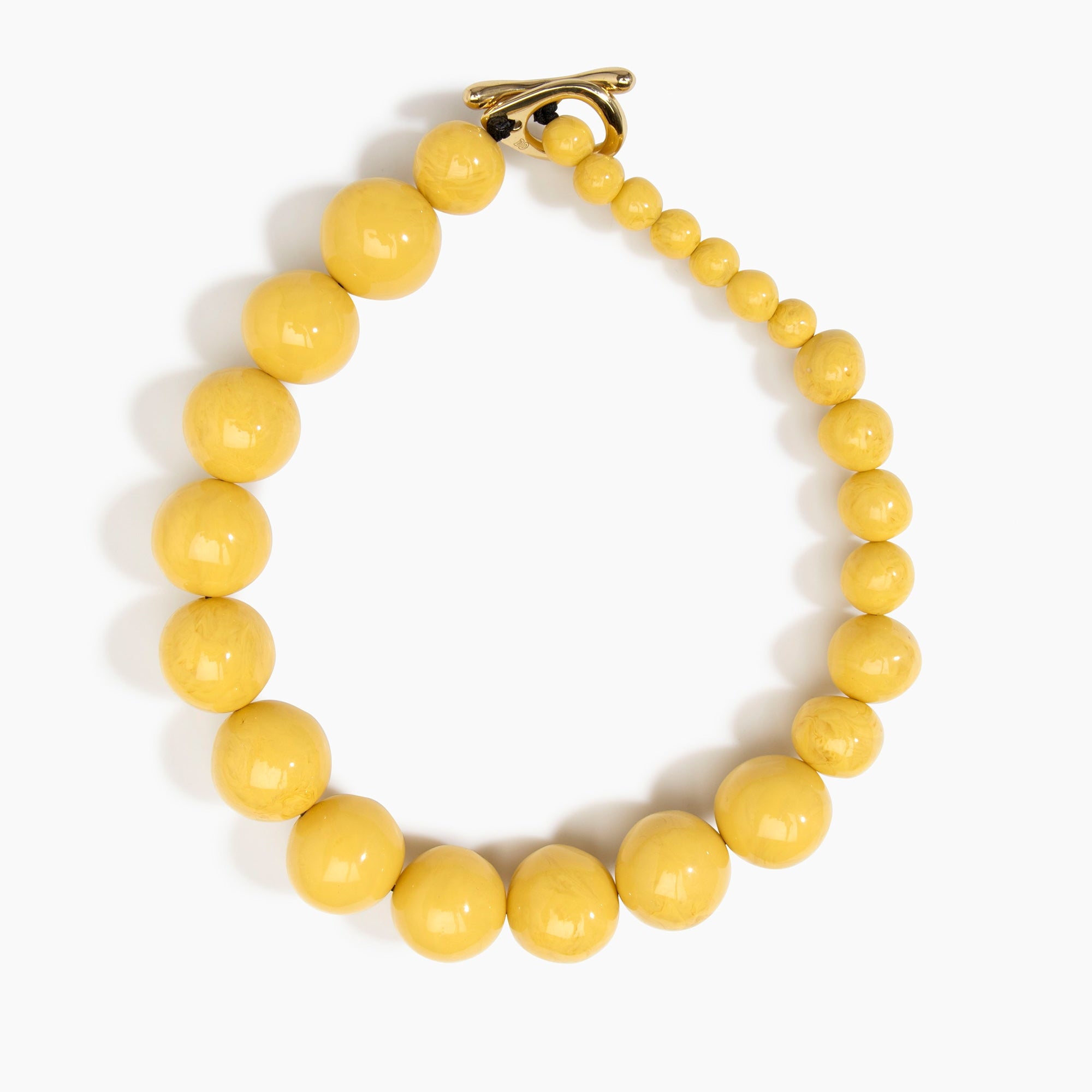 Dinosaur Designs Polished Organic Ball Choker in Pollen — handcrafted marbled yellow and clear polished resin graduating bead choker necklace with brass t-bar clasp