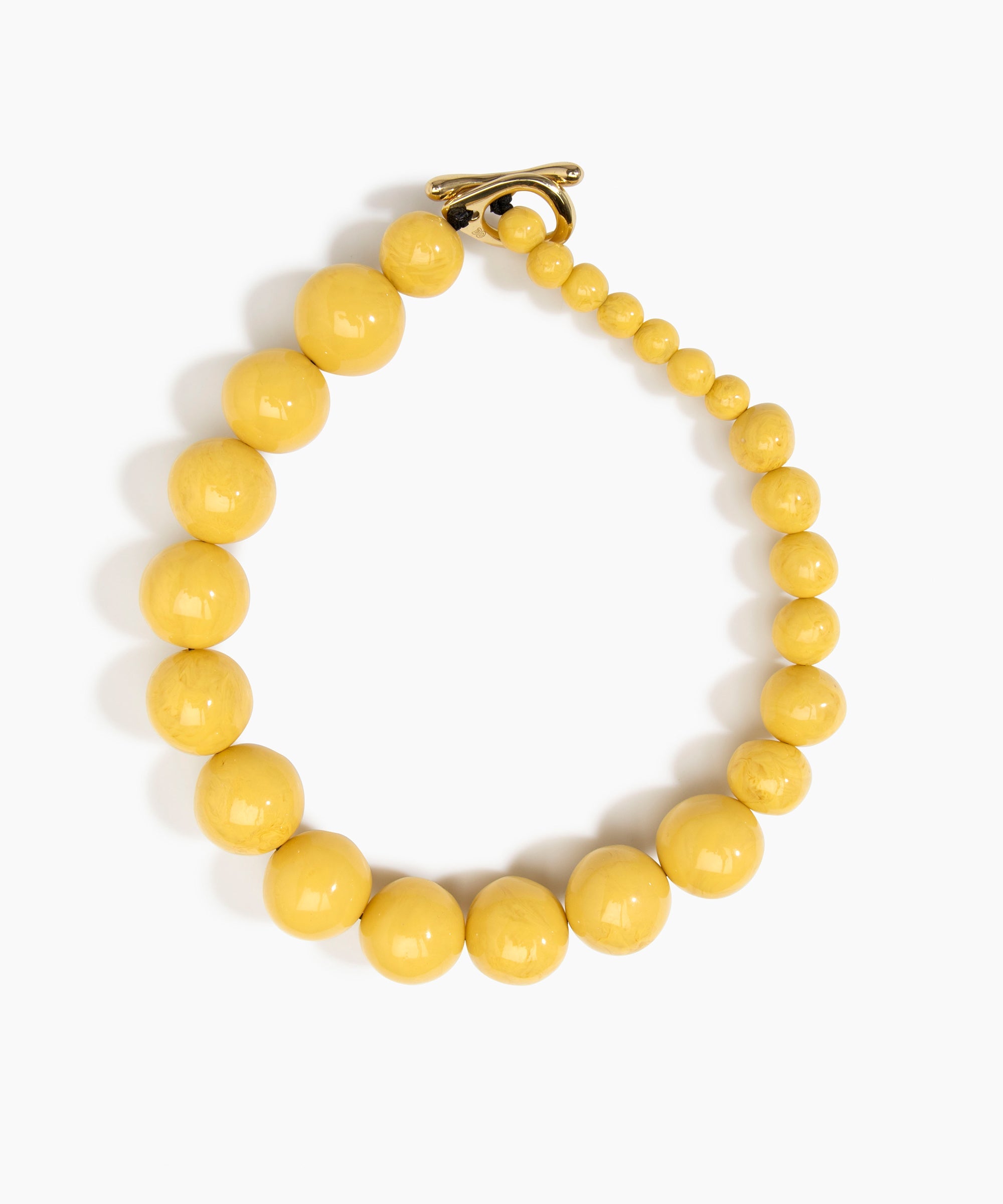 Dinosaur Designs Polished Organic Ball Choker in Pollen — handcrafted marbled yellow and clear polished resin graduating bead choker necklace with brass t-bar clasp