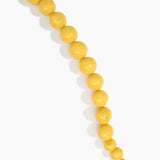 Dinosaur Designs Polished Organic Ball Choker in Pollen — handcrafted marbled yellow and clear polished resin graduating bead choker necklace with brass t-bar clasp