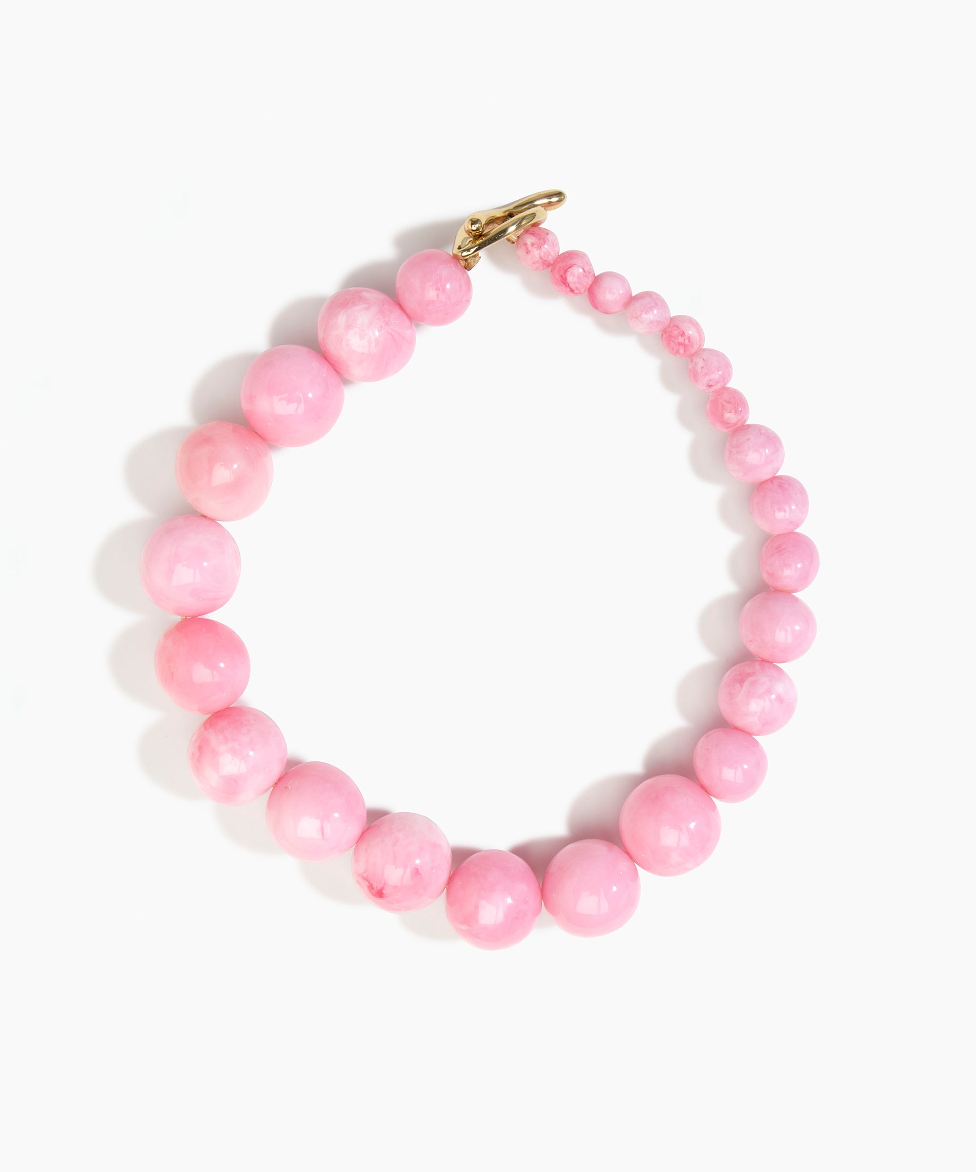 Dinosaur Designs Polished Organic Ball Choker in Shell Pink — handcrafted marbled pink polished resin graduating bead choker necklace with brass t-bar clasp