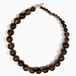 Dinosaur Designs Polished Organic Ball Necklace in Cocoa — handcrafted marbled brown and transparent polished resin graduating bead necklace with silver t-bar clasp.