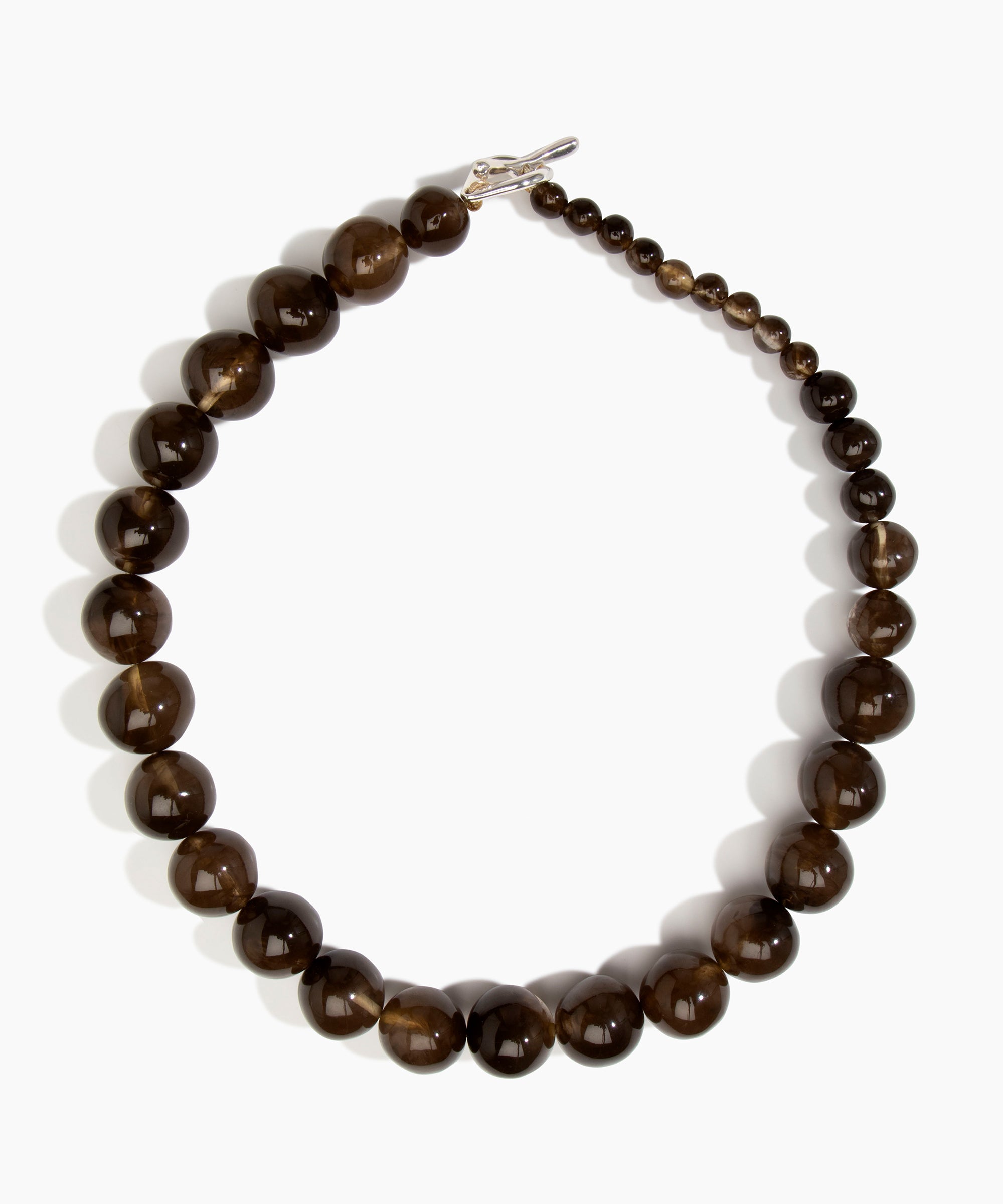 Dinosaur Designs Polished Organic Ball Necklace in Cocoa — handcrafted marbled brown and transparent polished resin graduating bead necklace with silver t-bar clasp.