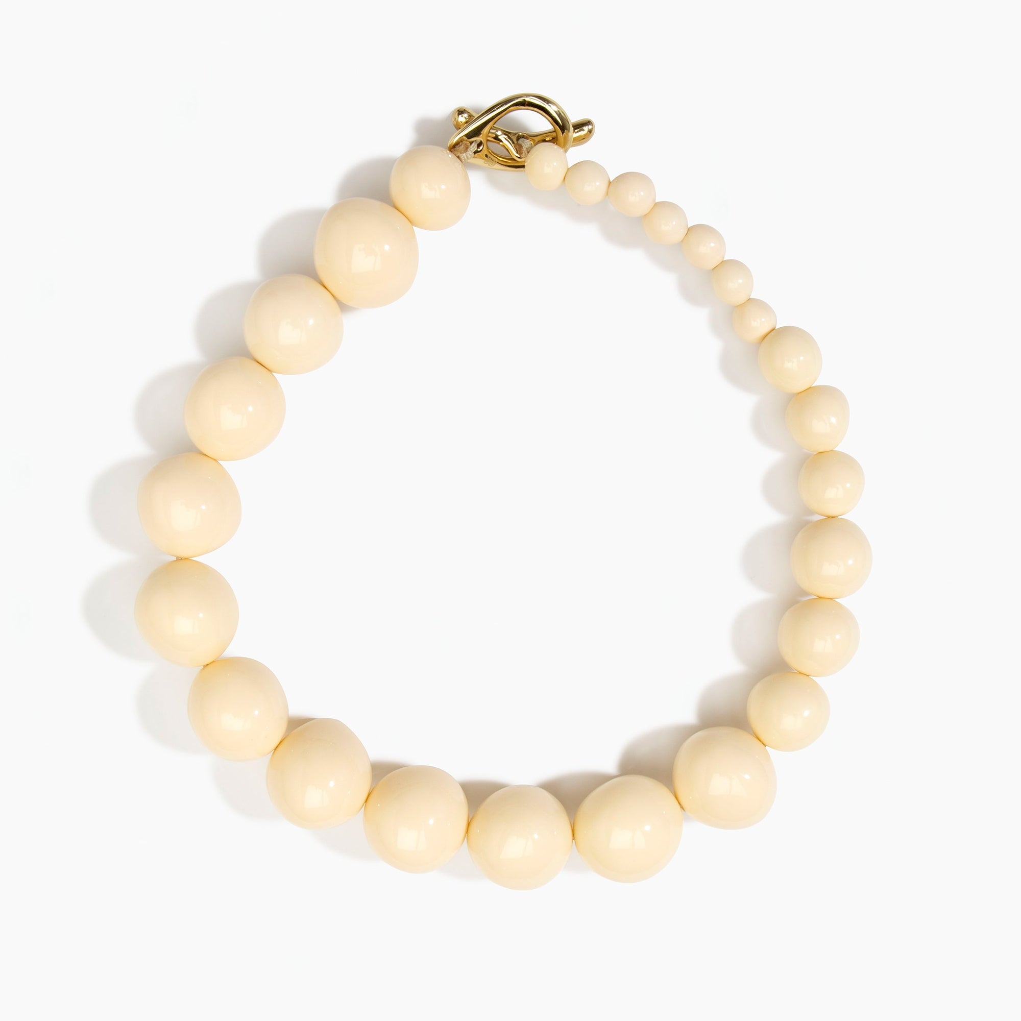 Dinosaur Designs Polished Organic Ball Choker in Cream — handcrafted cream polished resin graduating bead choker necklace with brass t-bar clasp...