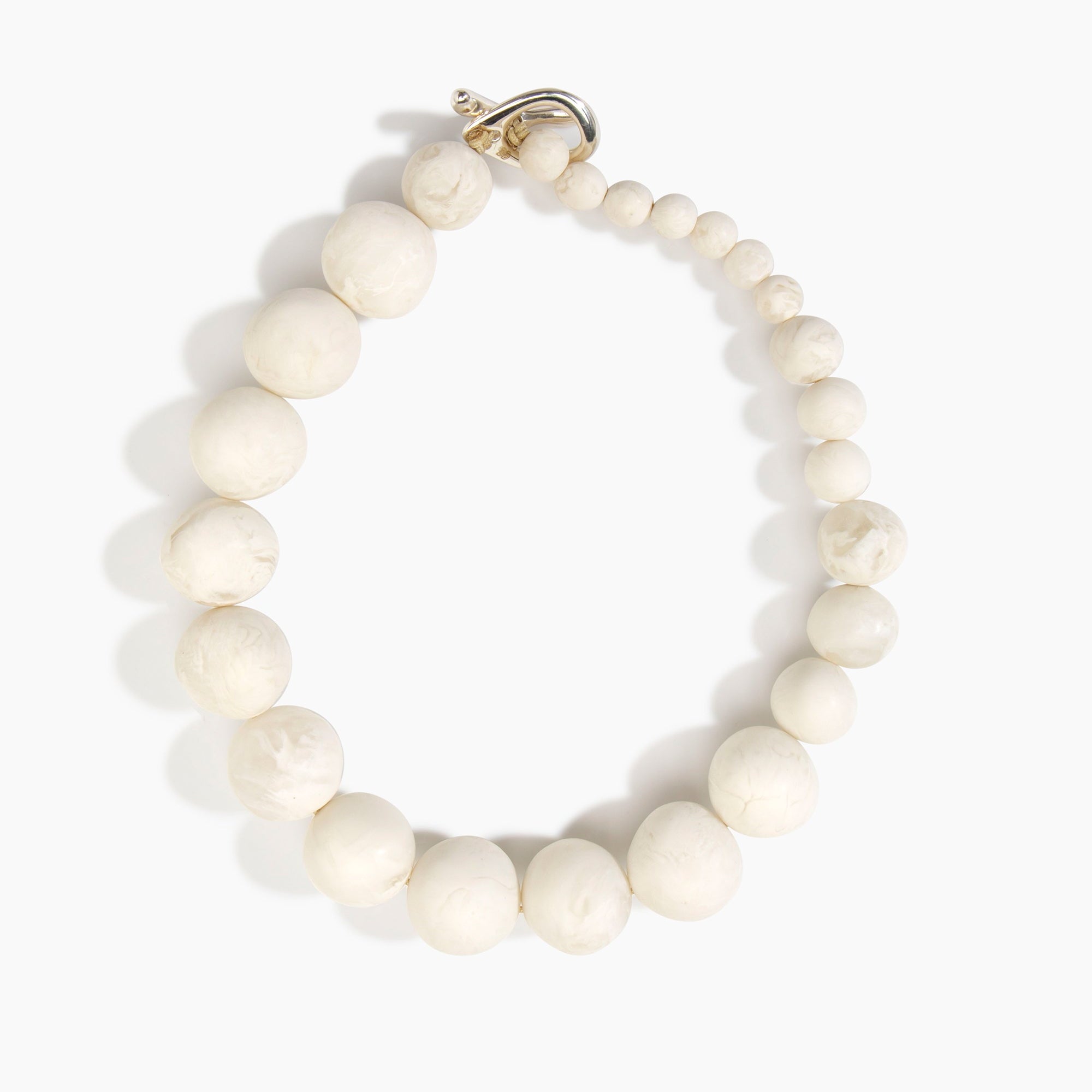Dinosaur Designs Organic Ball Choker in Chalk Swirl — handcrafted marbled off-white matte resin graduating bead choker necklace with silver t-bar clasp.