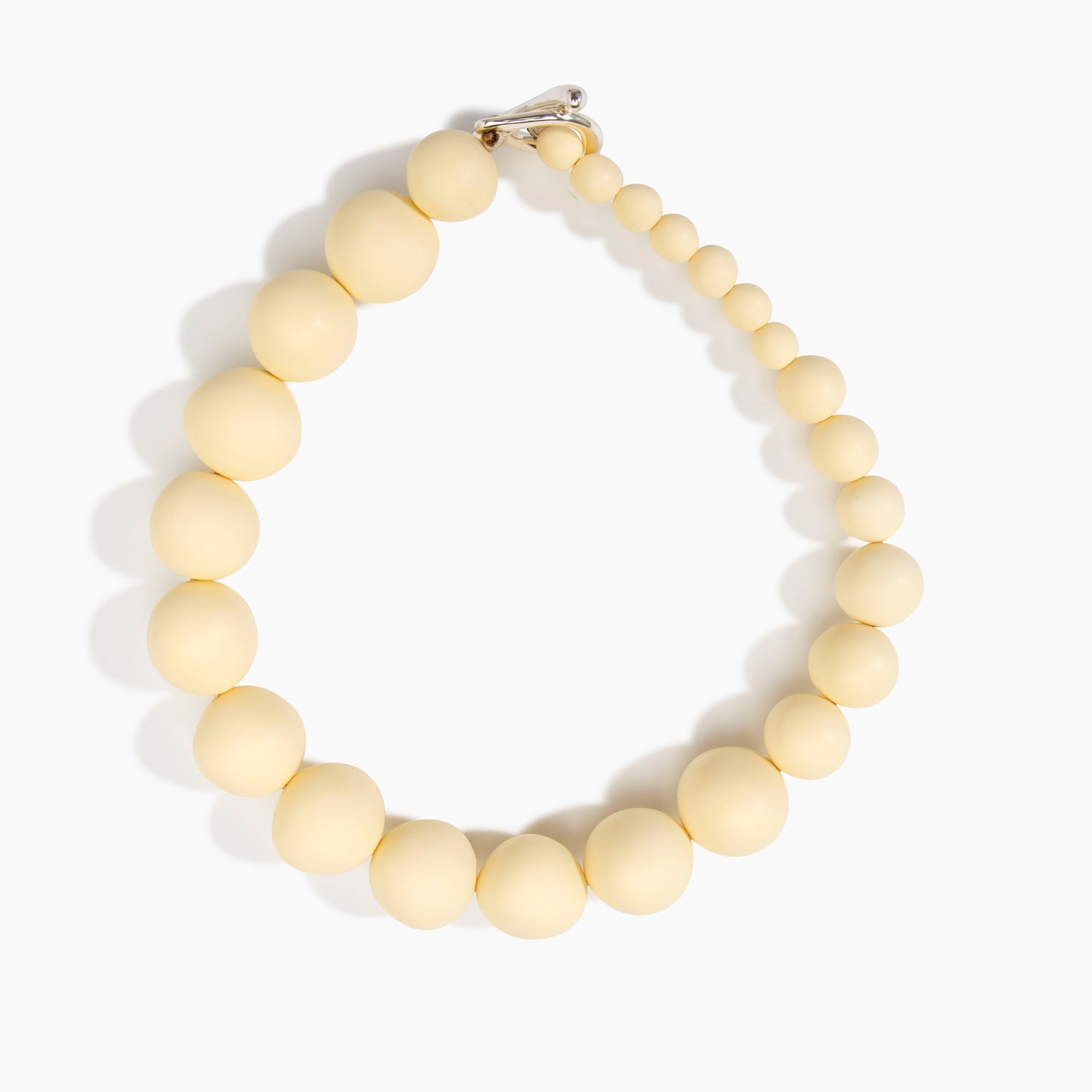 Dinosaur Designs Organic Ball Choker in Cream — handcrafted cream matte resin graduating bead choker necklace with silver t-bar clasp.