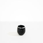 Dinosaur Designs Large Rock Cup in Black Marble — handcrafted marbled black and white resin cup with rounded bulbous form and open organic rim..