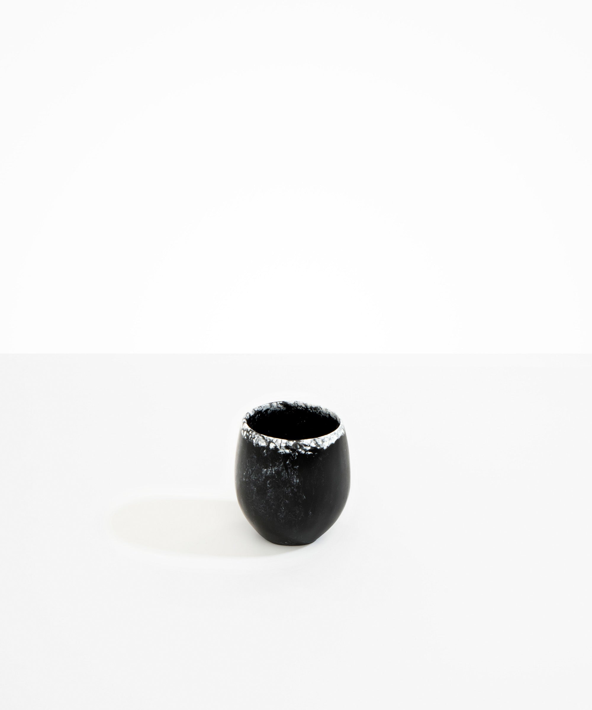 Dinosaur Designs Large Rock Cup in Black Marble — handcrafted marbled black and white resin cup with rounded bulbous form and open organic rim..
