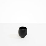 Dinosaur Designs Large Rock Cup in Black — handcrafted black resin cup with rounded bulbous form and open organic rim..