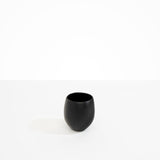 Dinosaur Designs Large Rock Cup in Black — handcrafted black resin cup with rounded bulbous form and open organic rim..