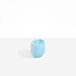 Dinosaur Designs Large Rock Cup in Pool — handcrafted marbled blue and transparent resin cup with rounded bulbous form and open organic rim..