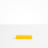 Dinosaur Designs Corey Ashford Citrus Grove Japanese Incense — yellow box of sandalwood, yuzu and orange scented incense sticks