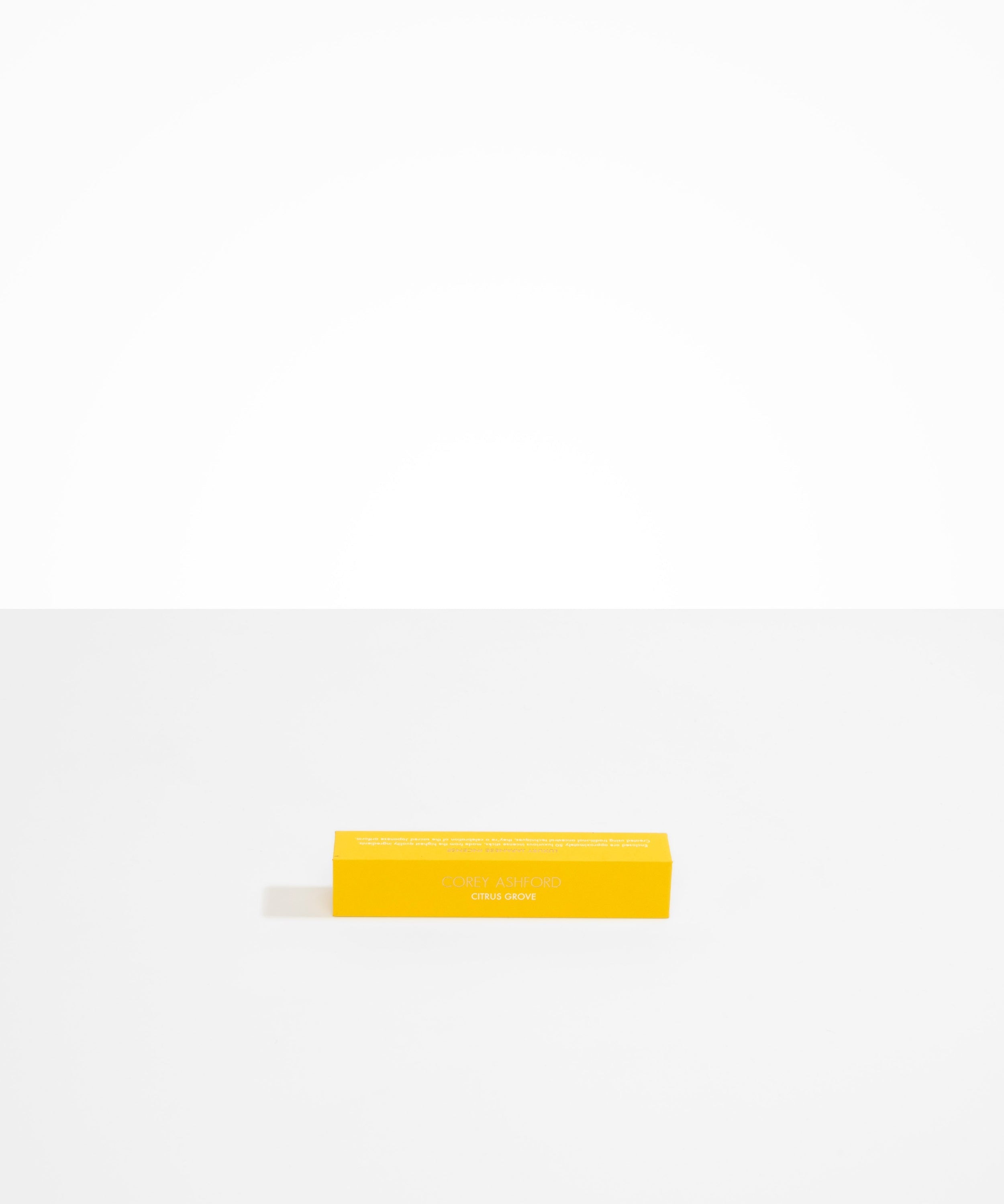 Dinosaur Designs Corey Ashford Citrus Grove Japanese Incense — yellow box of sandalwood, yuzu and orange scented incense sticks
