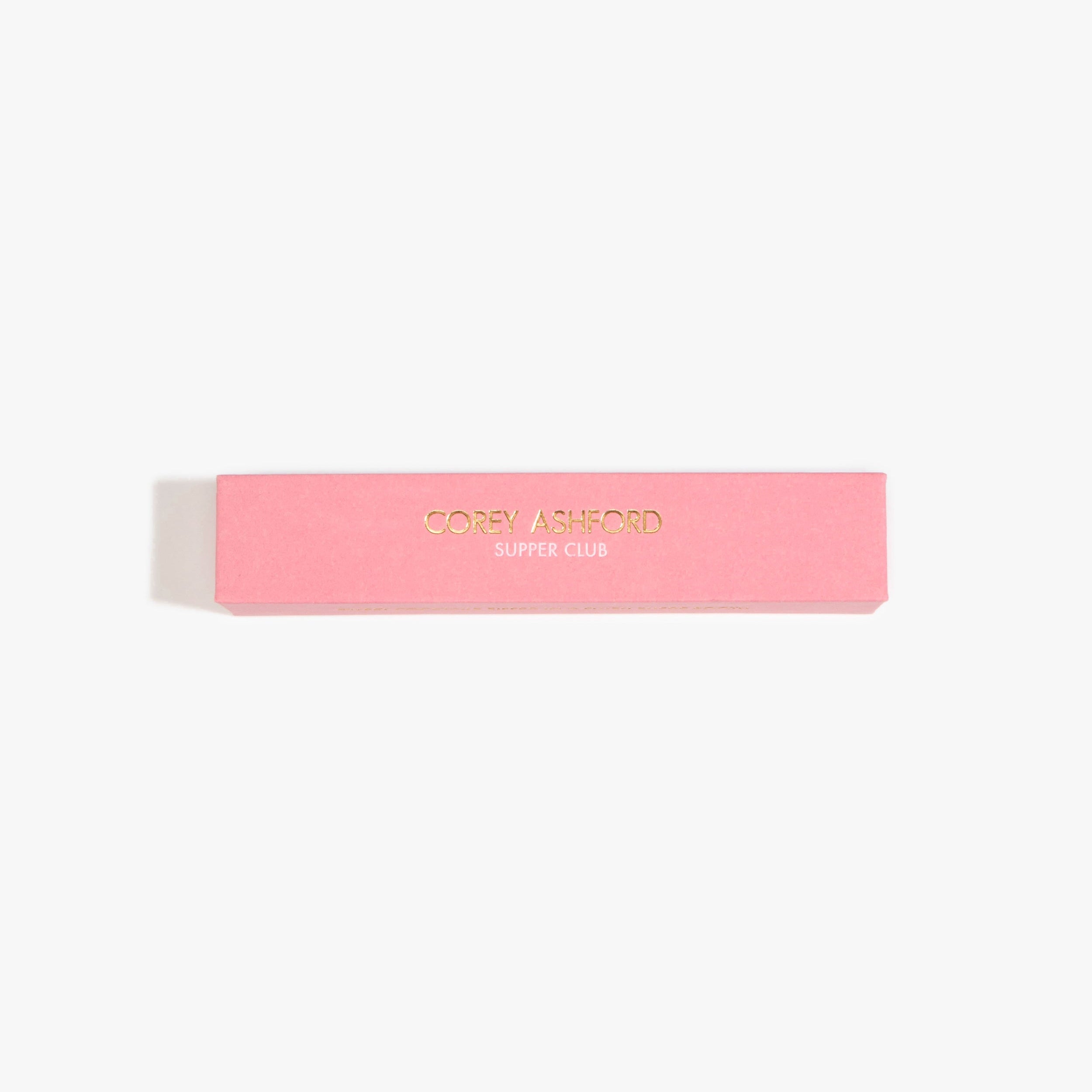 Dinosaur Designs Corey Ashford Supper Club Japanese Incense — pink box of cedar, tobacco and apricot scented incense sticks.
