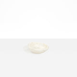 Dinosaur Designs Bones Dish in Chalk Swirl — small handcrafted marbled off-white resin trinket dish with organic form