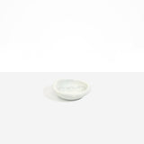 Dinosaur Designs Bones Dish in Cloud — small handcrafted grey and cream marbled resin trinket dish with organic form