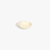 Dinosaur Designs Bones Dish in Cream — small handcrafted resin trinket dish with organic form