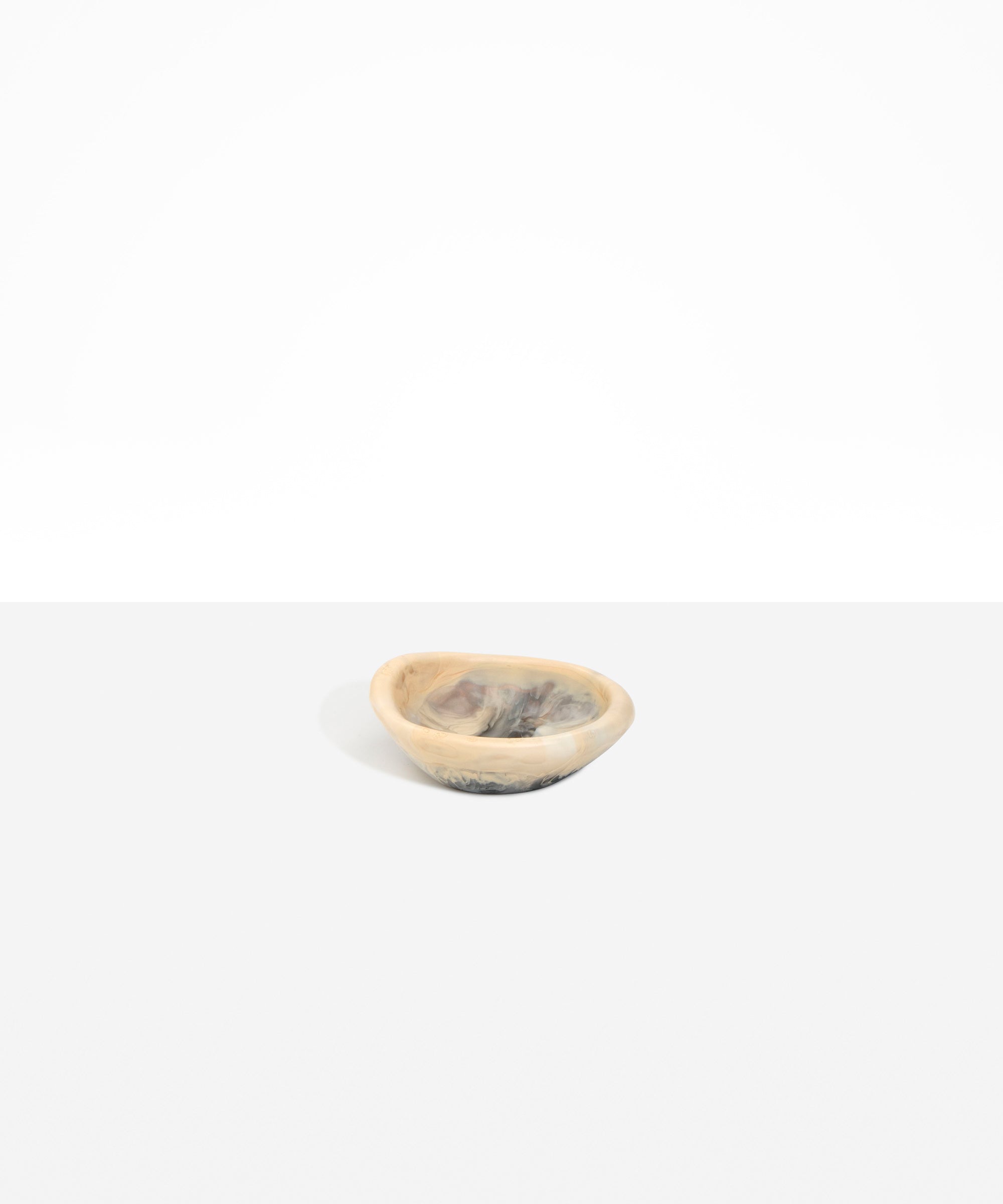 Dinosaur Designs Bones Dish in Sandy Pearl — small handcrafted marbled beige, grey and pearlescent resin trinket dish with organic form