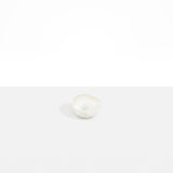 Dinosaur Designs Beetle Dish in Chalk Swirl — handcrafted marbled off-white resin miniature salt dish with rounded organic form