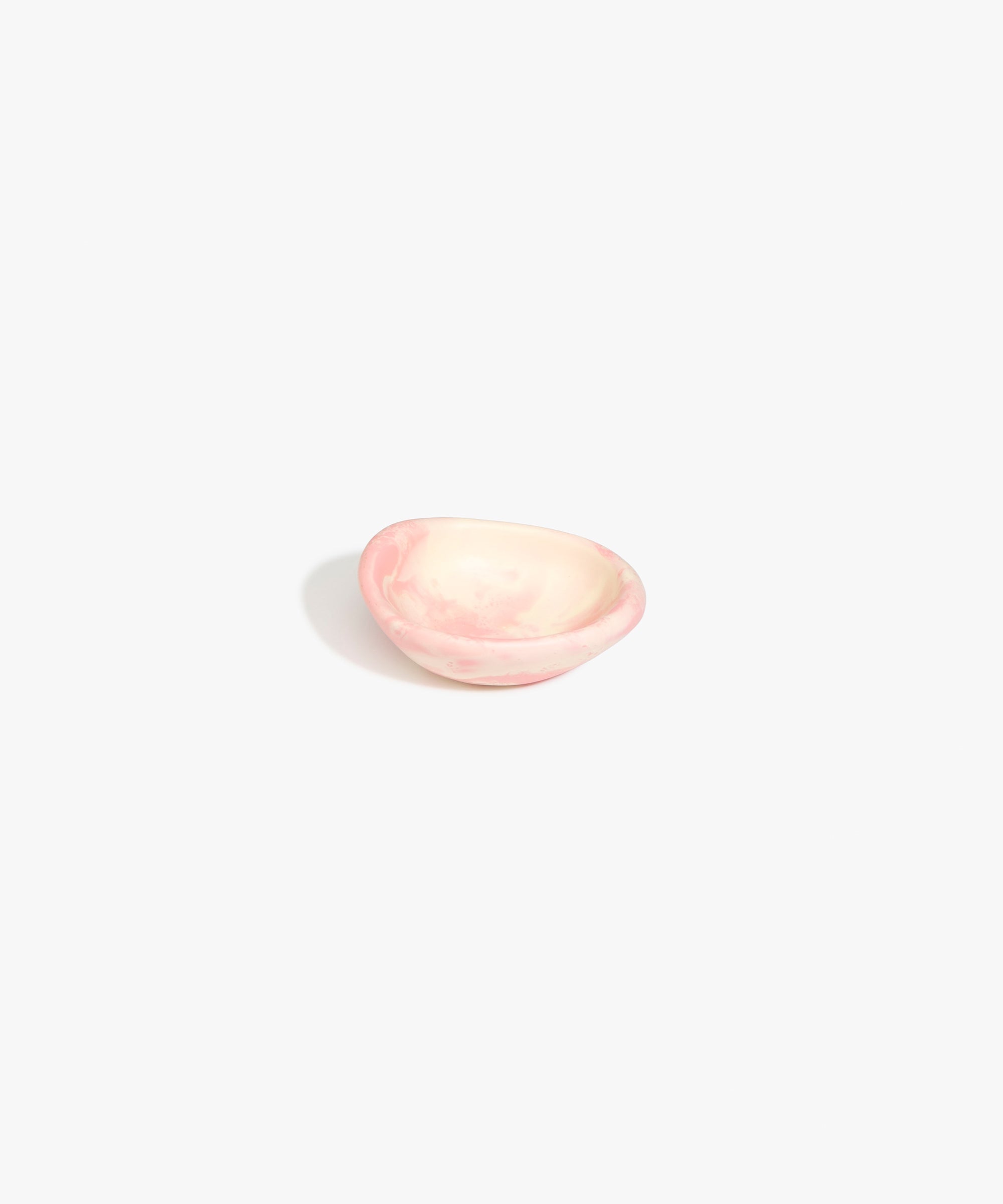 Dinosaur Designs Bones Dish in Blossom — small handcrafted marbled pink and cream resin trinket dish with organic form