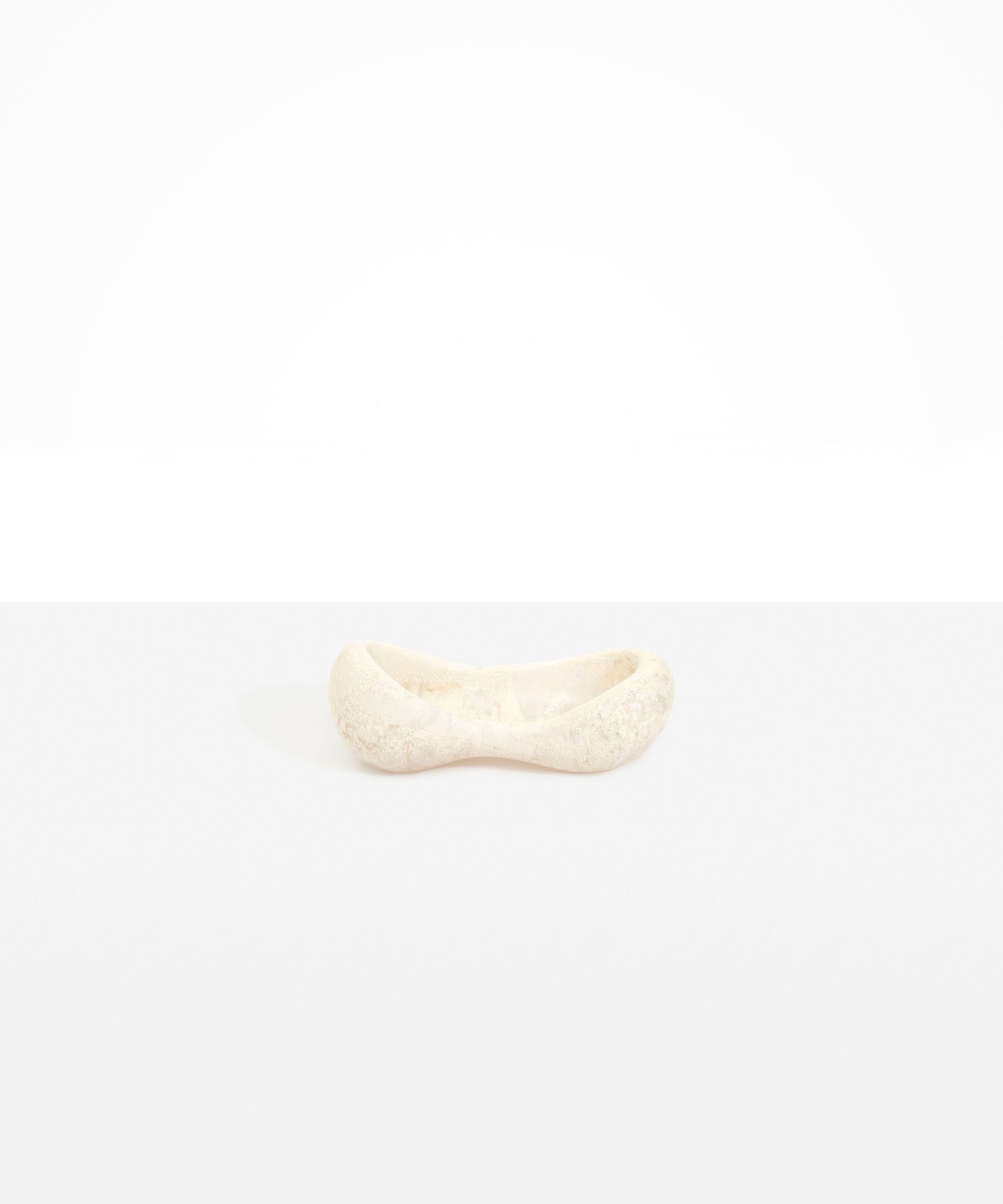 Dinosaur Designs Bones Dish in Chalk Swirl — handcrafted marbled off-white resin trinket dish with pinched bone-shaped organic form