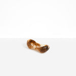 Dinosaur Designs Bones Dish in Light Horn — handcrafted marbled brown, cream and translucent resin trinket dish with pinched bone-shaped organic form