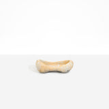Dinosaur Designs Bones Dish in Sandy Pearl — handcrafted marbled beige and pearlescent resin trinket dish with pinched bone-shaped organic form