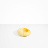 Dinosaur Designs Drift Dish in Daisy— handcrafted marbled light and dark yellow resin chunky trinket dish with organic form