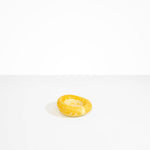 Dinosaur Designs Medium Drift Dish in Daisy— handcrafted marbled light and dark yellow resin chunky trinket dish with organic form