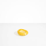 Dinosaur Designs Medium Drift Dish in Daisy— handcrafted marbled light and dark yellow resin chunky trinket dish with organic form