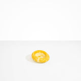 Dinosaur Designs Medium Drift Dish in Daisy— handcrafted marbled light and dark yellow resin chunky trinket dish with organic form