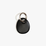 Dinosaur Designs Earth Keyring in Black — handcrafted Black resin pebble bead on a polished gunmetal jump ring..