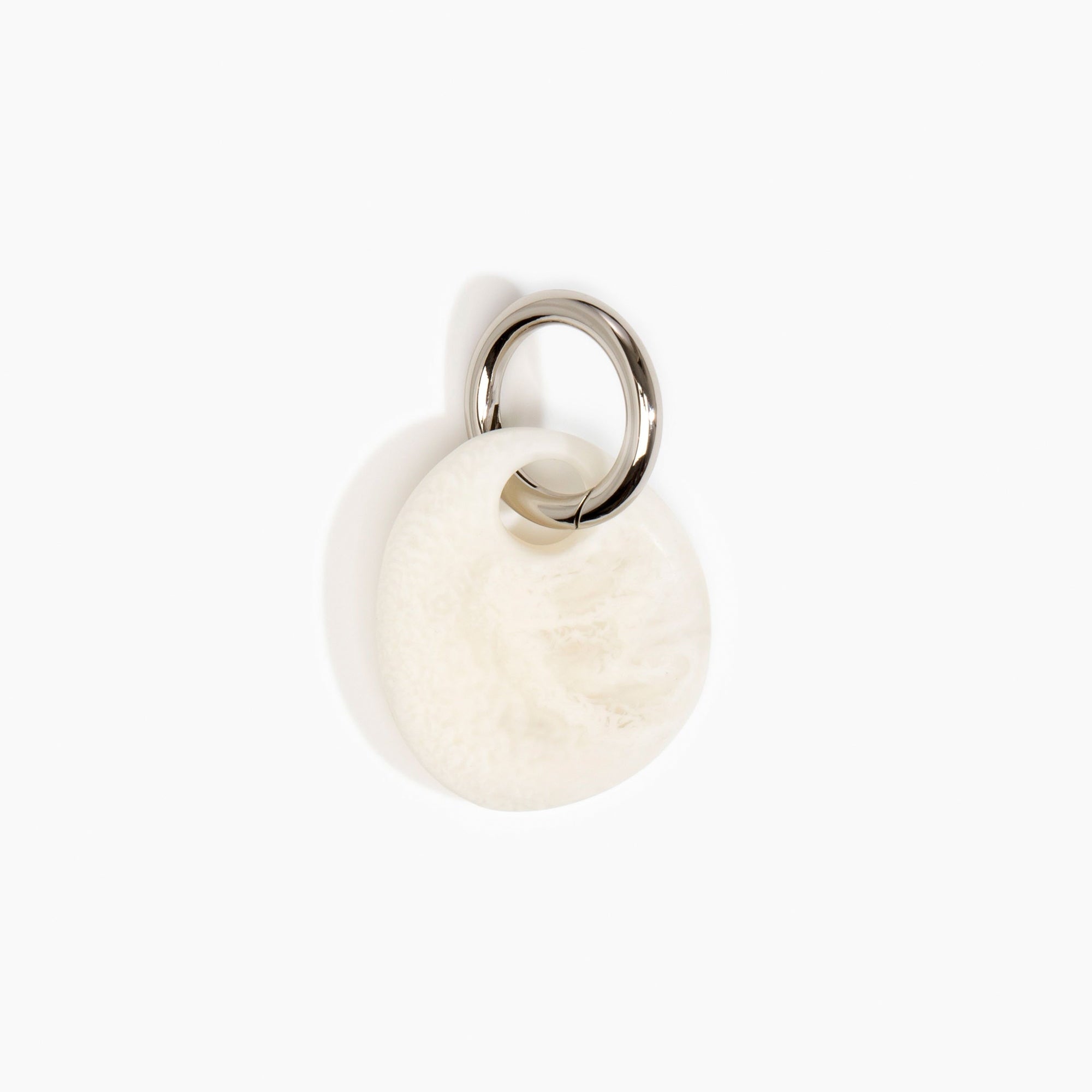 Dinosaur Designs Earth Keyring in Chalk Swirl — handcrafted marbled off white resin pebble bead on a polished gunmetal jump ring..