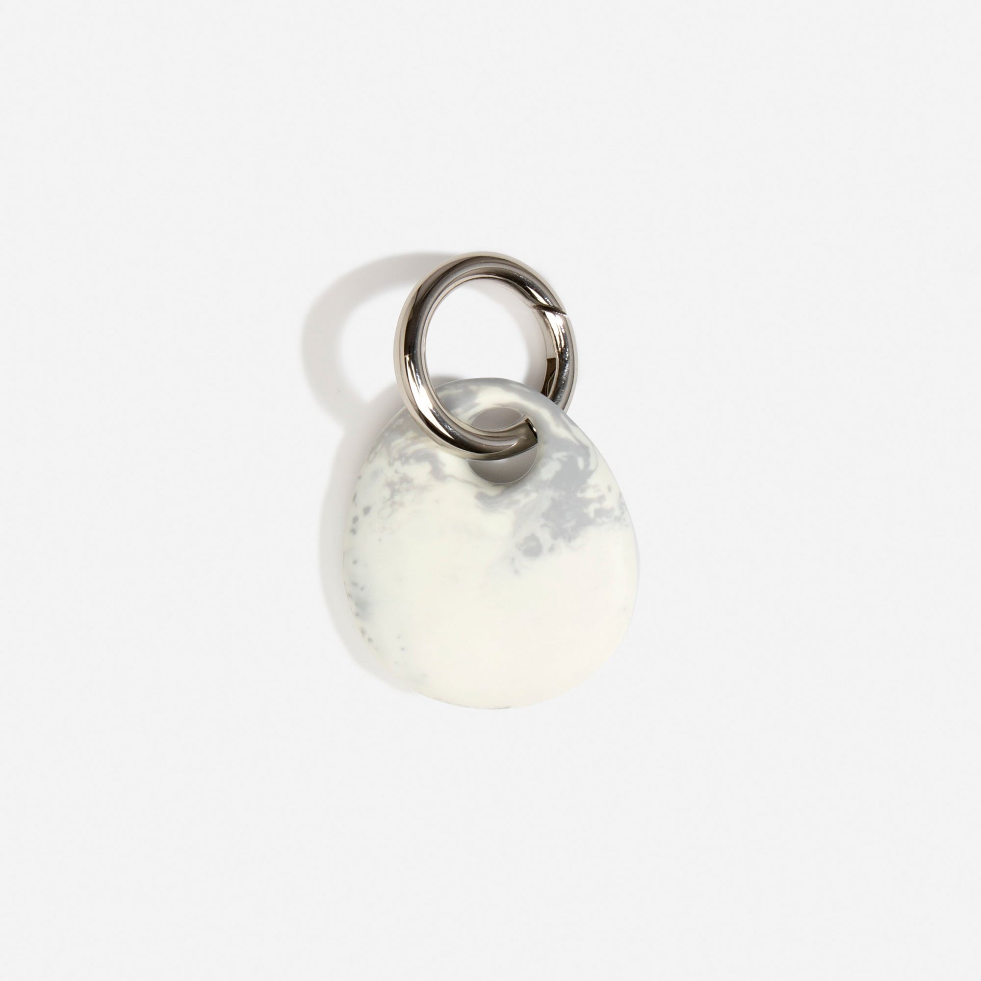 Dinosaur Designs Earth Keyring in Cloud — handcrafted marbled grey and Cream resin pebble bead on a polished gunmetal jump ring..