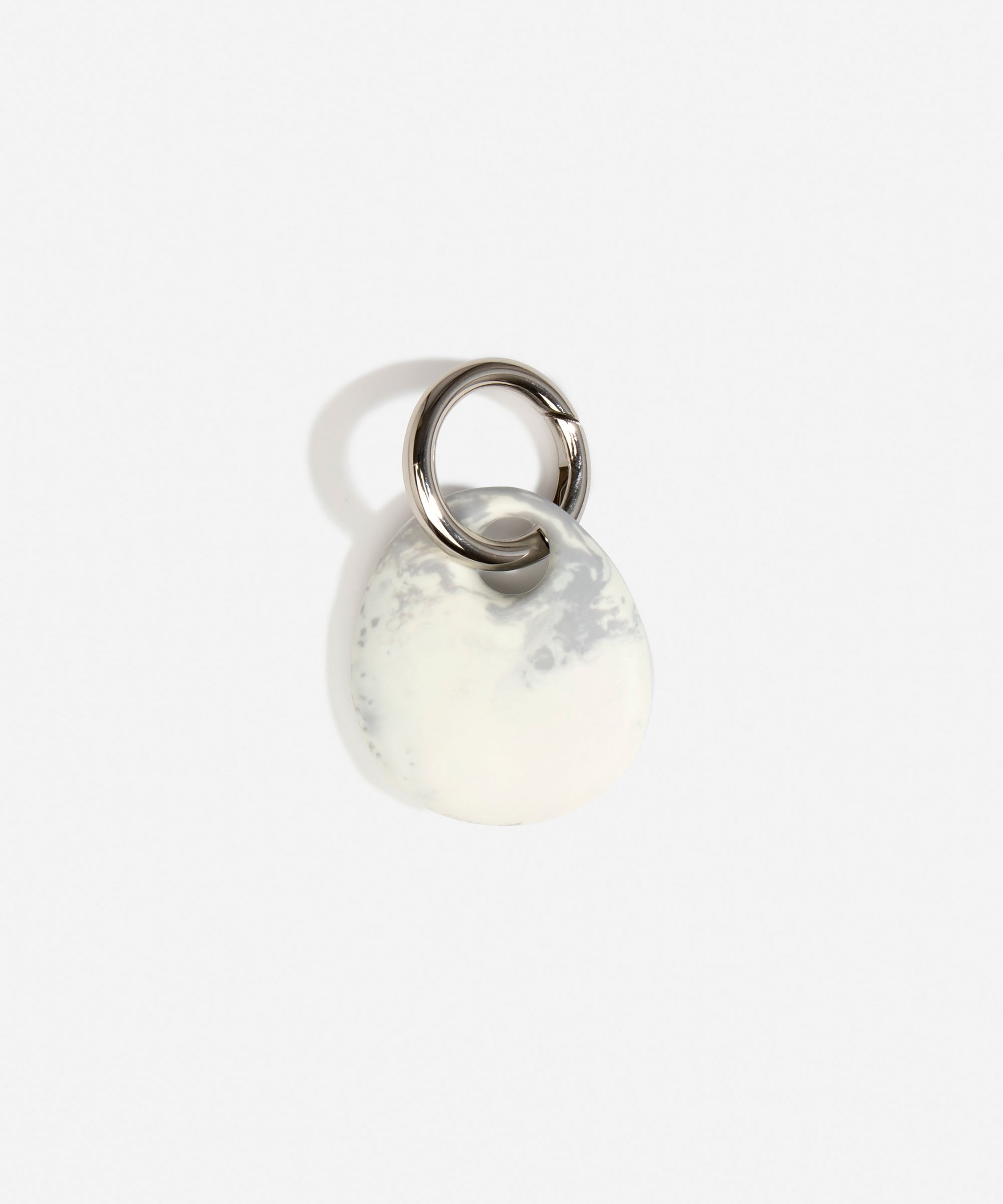 Dinosaur Designs Earth Keyring in Cloud — handcrafted marbled grey and Cream resin pebble bead on a polished gunmetal jump ring
