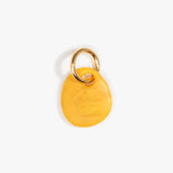 Dinosaur Designs Earth Keyring in Honeycomb — handcrafted marbled mustard yellow resin pebble bead on a polished brass jump ring..