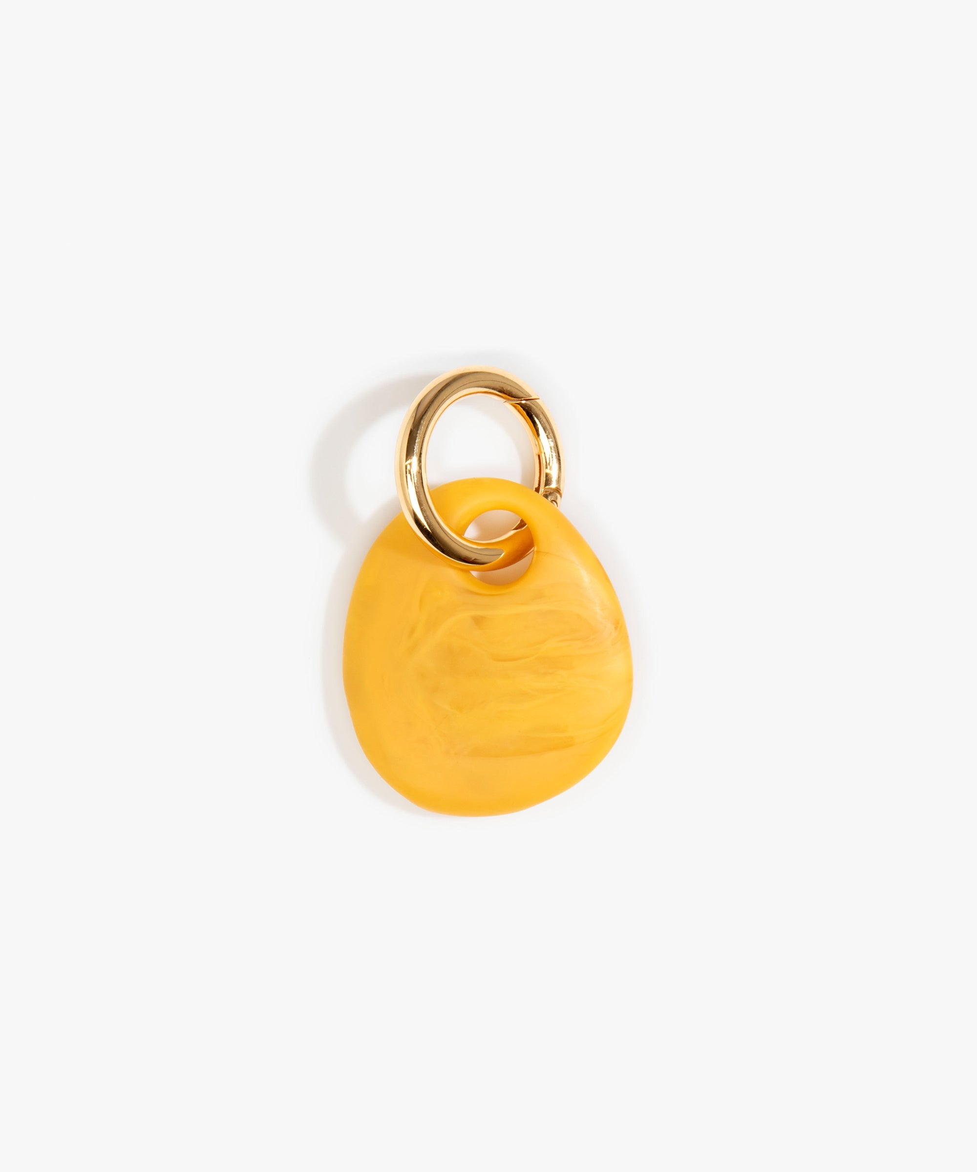 Dinosaur Designs Earth Keyring in Honeycomb — handcrafted marbled mustard yellow resin pebble bead on a polished brass jump ring..