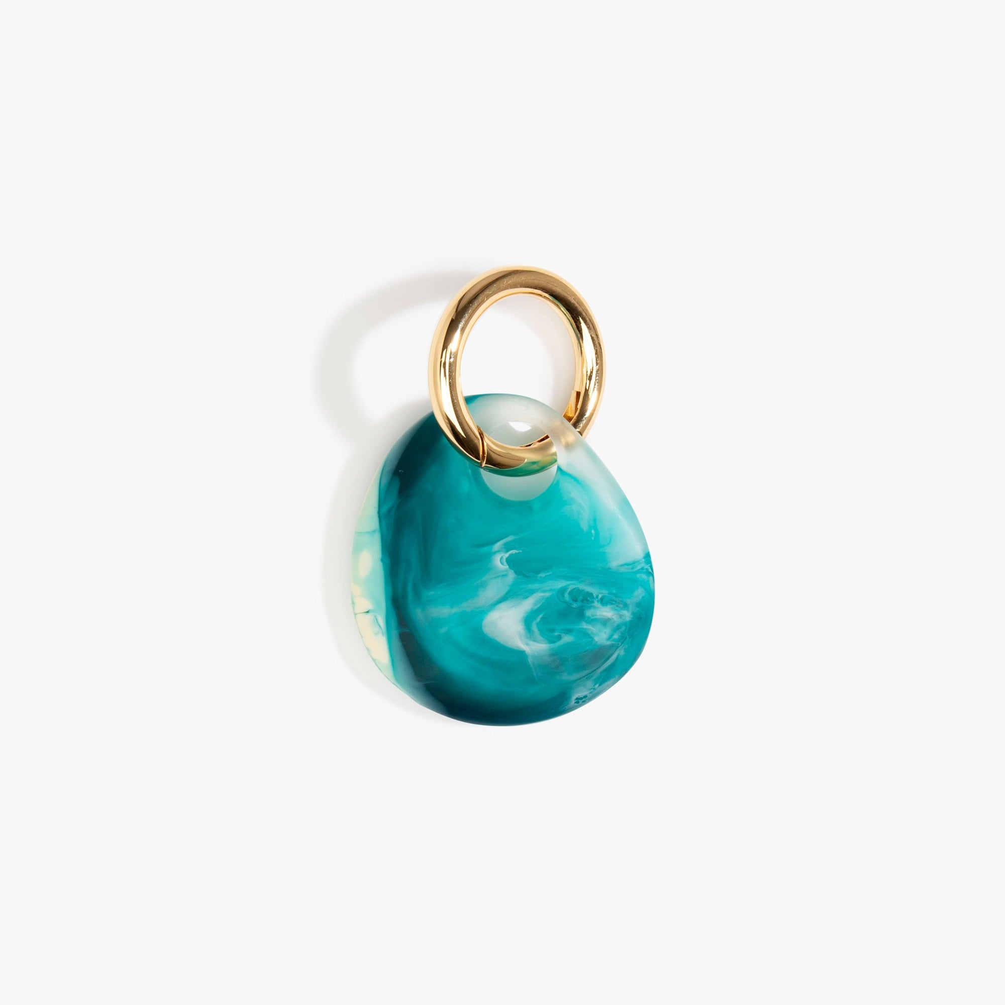 Dinosaur Designs Earth Keyring in Lagoon — handcrafted marbled blue and Cream resin pebble bead on a polished brass jump ring..