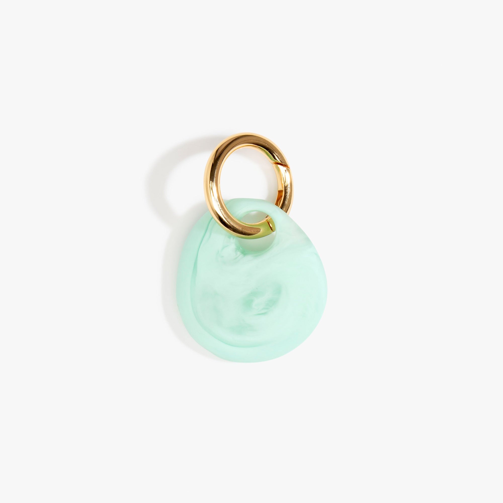 Dinosaur Designs Earth Keyring in Mint— handcrafted marbled green blue resin pebble bead on a polished brass jump ring..