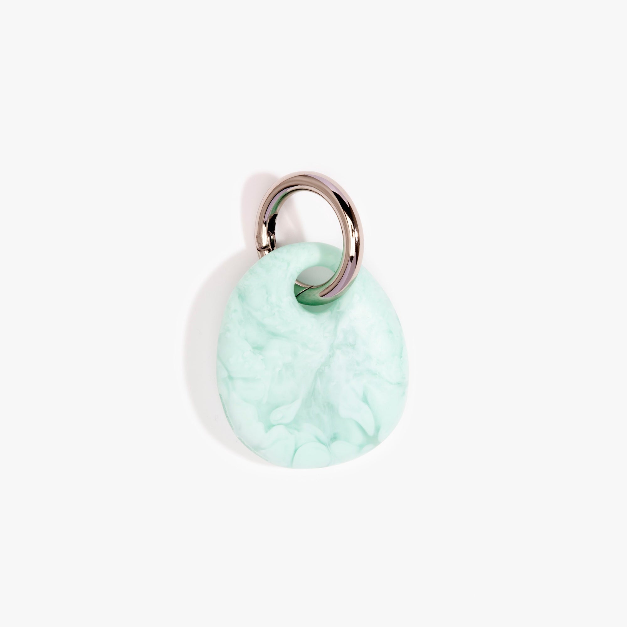 Dinosaur Designs Earth Keyring in Mint— handcrafted marbled green blue resin pebble bead on a polished gunmetal jump ring..