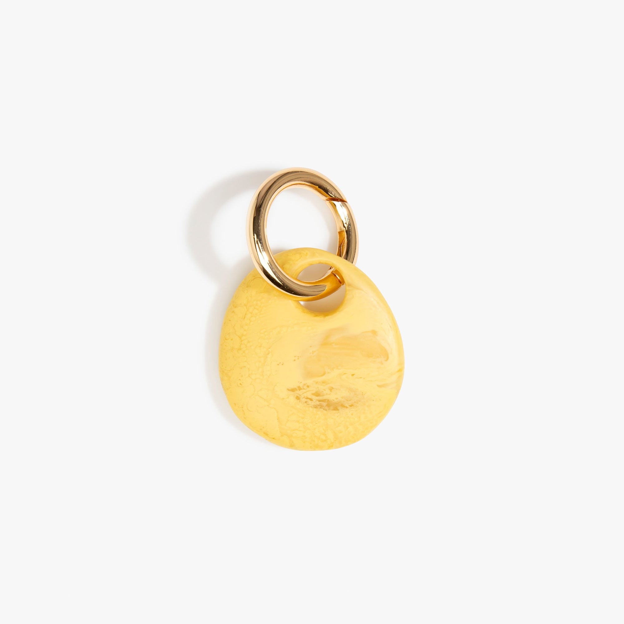 Dinosaur Designs Earth Keyring in Pollen — handcrafted marbled yellow and clear resin pebble bead on a polished brass jump ring..