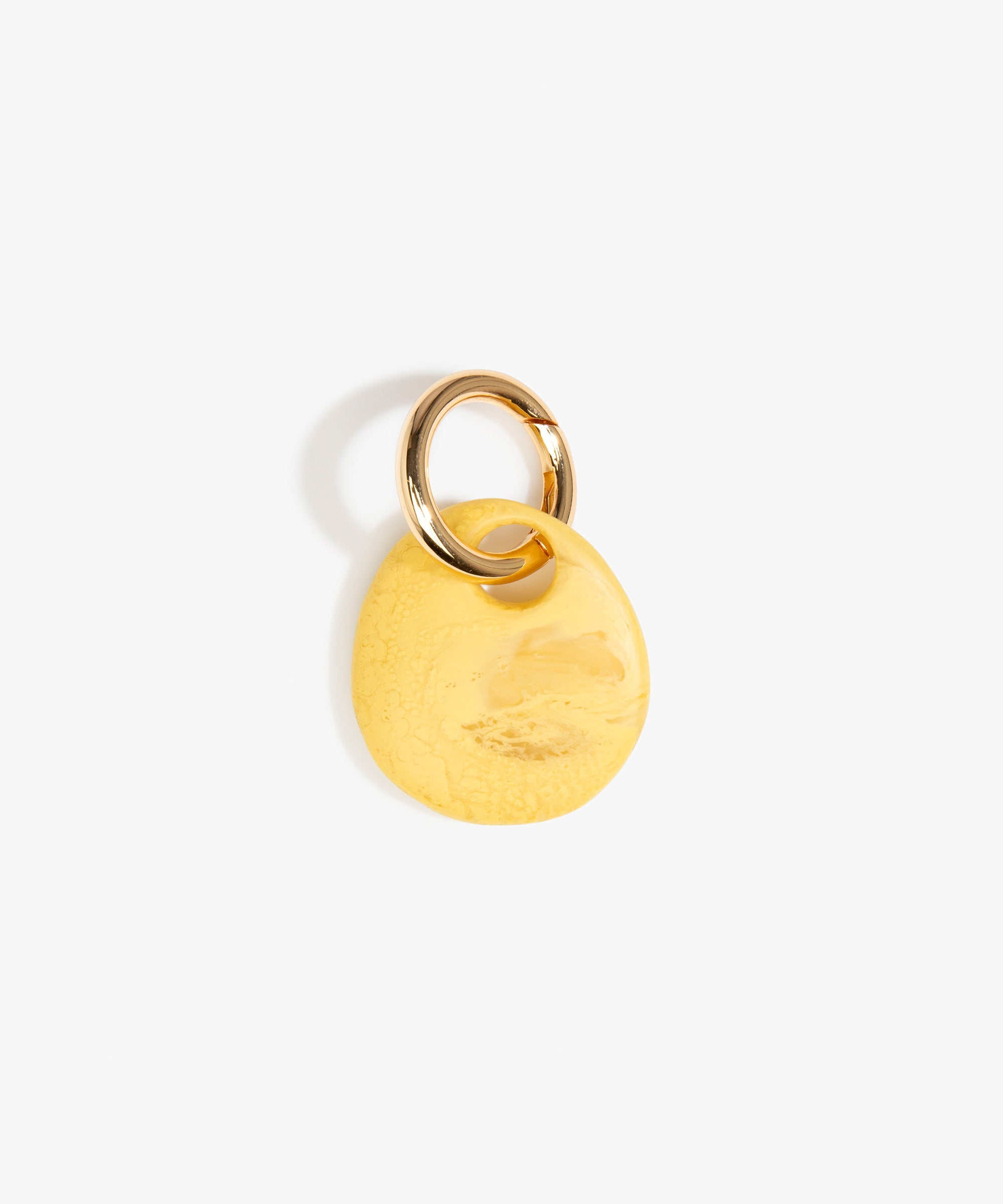 Dinosaur Designs Earth Keyring in Pollen — handcrafted marbled yellow and clear resin pebble bead on a polished brass jump ring..